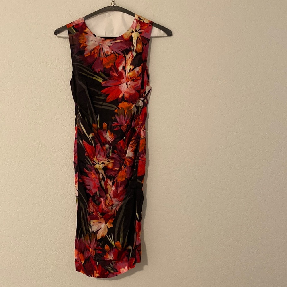 Nicole Miller form fitting dress size 4 women’s. The rouching is flattering.